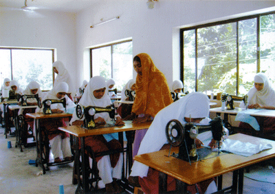 Girl inmates engaged in dressmaking